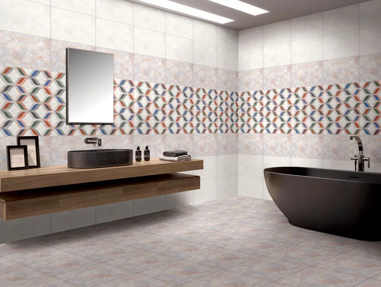 Modern grey bathroom design featuring a matte black bathtub and countertop sink